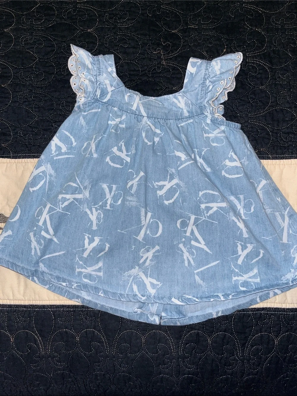Calvin Klein Jeans Pale Blue Abstract Infant top with Wood-Tone Buttons